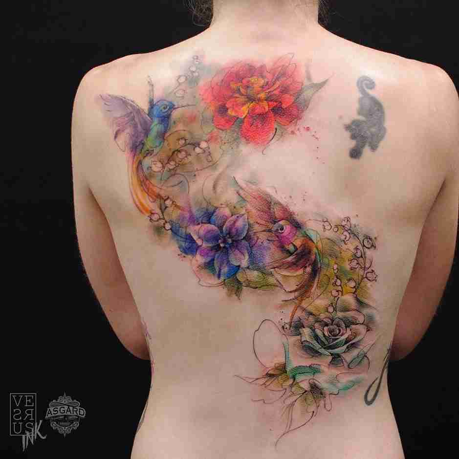 Colorful butterfly tattoo design on back for women.