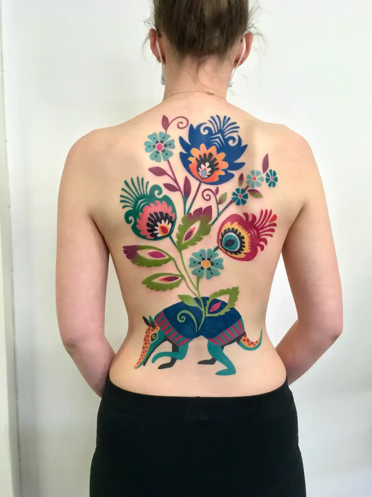 Colorful butterfly tattoo design on back for women