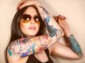 Colorful sleeve tattoo on arm before laser tattoo removal